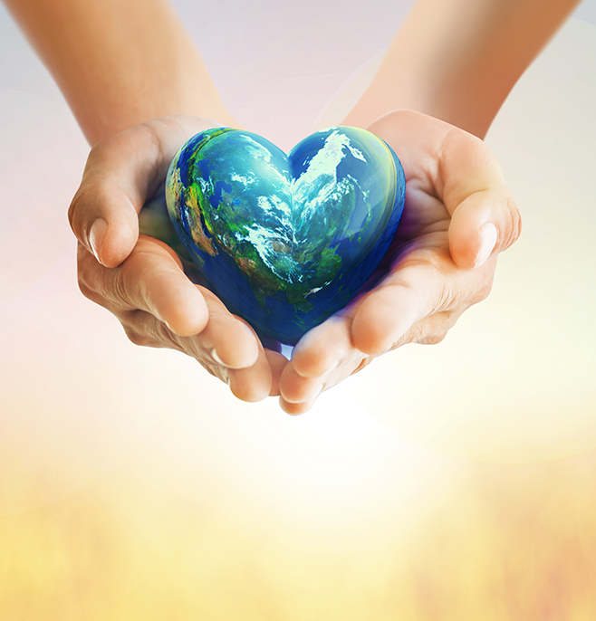 Socially Good - two hands holding a globe in the shape of a heart
